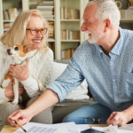 April 25 Events Page Image - Point Pleasant Elderly man and woman smiling and holding small dog