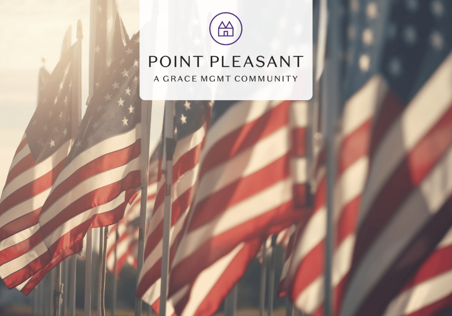 Row of American flags with a translucent overlay showing the Point Pleasant logo and the text 'POINT PLEASANT A GRACE MGMT COMMUNITY'